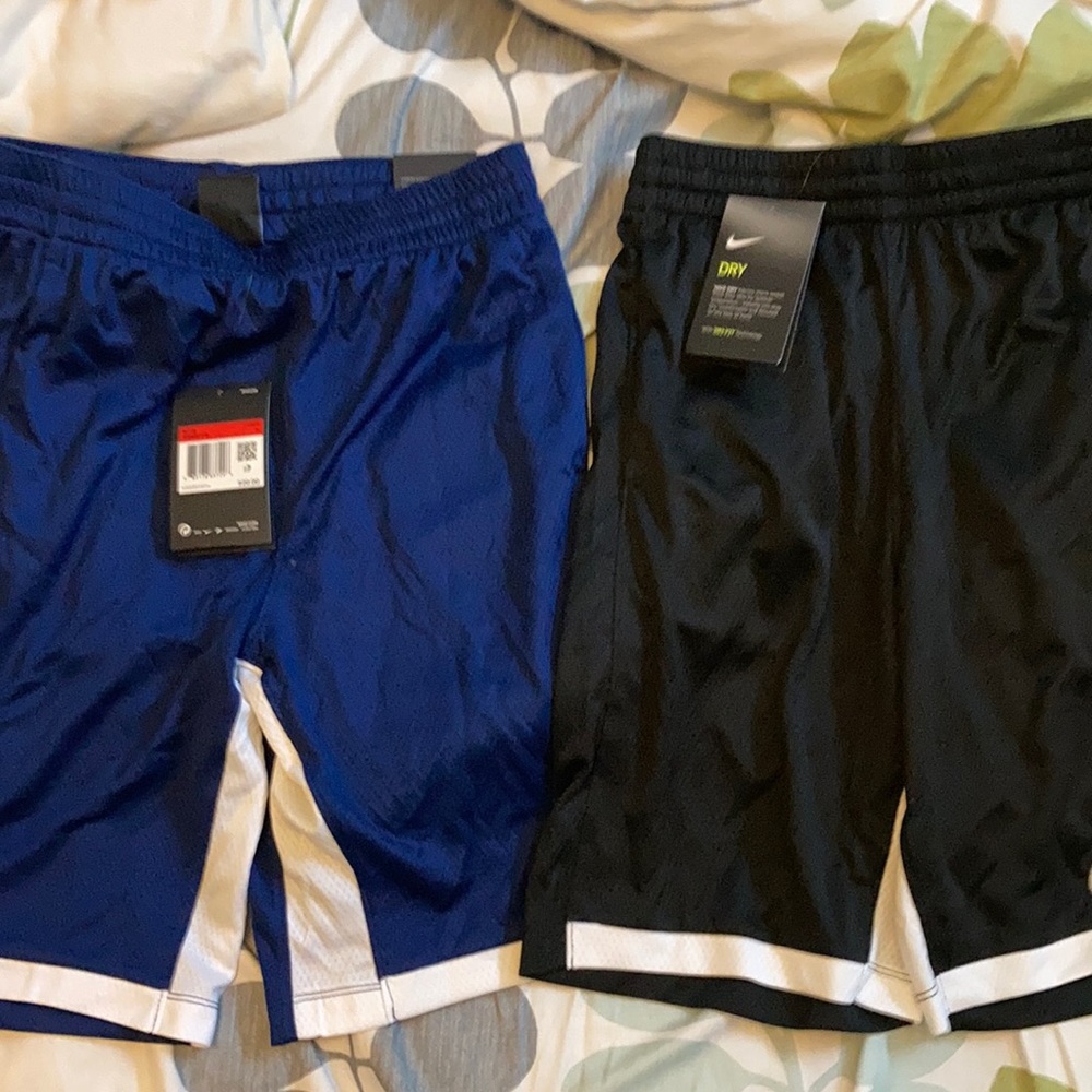 Two pairs of boy’s Nike basketball shorts, size L